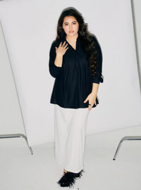 A woman dressed in All Black Regular Striped Slim FIt Polo