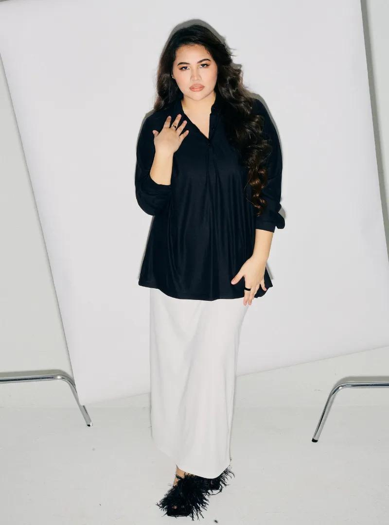 A woman dressed in All Black Regular Striped Slim FIt Polo
