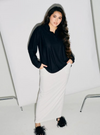 A woman dressed in All Black Regular Striped Slim FIt Polo