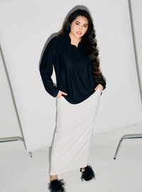 A woman dressed in All Black Regular Striped Slim FIt Polo
