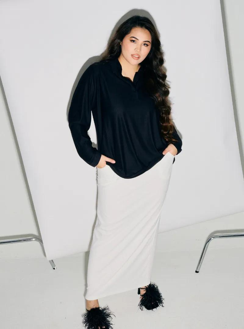 A woman dressed in All Black Regular Striped Slim FIt Polo