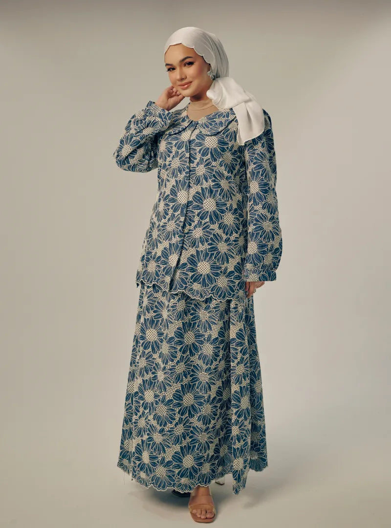 A woman dressed in Turquoise Tun Habiba Eyelet Set