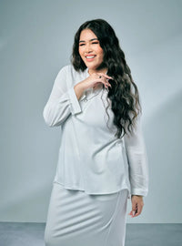 A woman dressed in White Naddy Mandarin Collar Slim Fit Polo Shirt