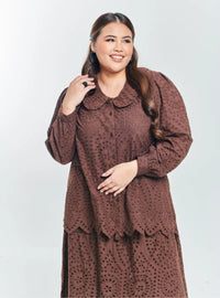 A woman Walnut Tun Hasmah Eyelet Skirt Set