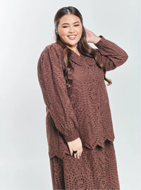A woman Walnut Tun Hasmah Eyelet Skirt Set