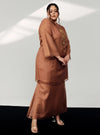 A woman in dressed in Walnut Tun Sharimah Organza Kurung