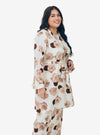 A woman dressed in White Aminah Kurung Modern