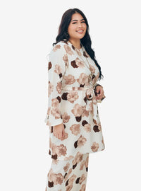 A woman dressed in White Aminah Kurung Modern