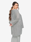 A woman dressed in White Striped Mandarin Collar Oversized Shirt