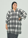 A woman dressed in White Tanah Tun Azeeza Kaftan Top