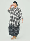 A woman dressed in White Tanah Tun Azeeza Kaftan Top